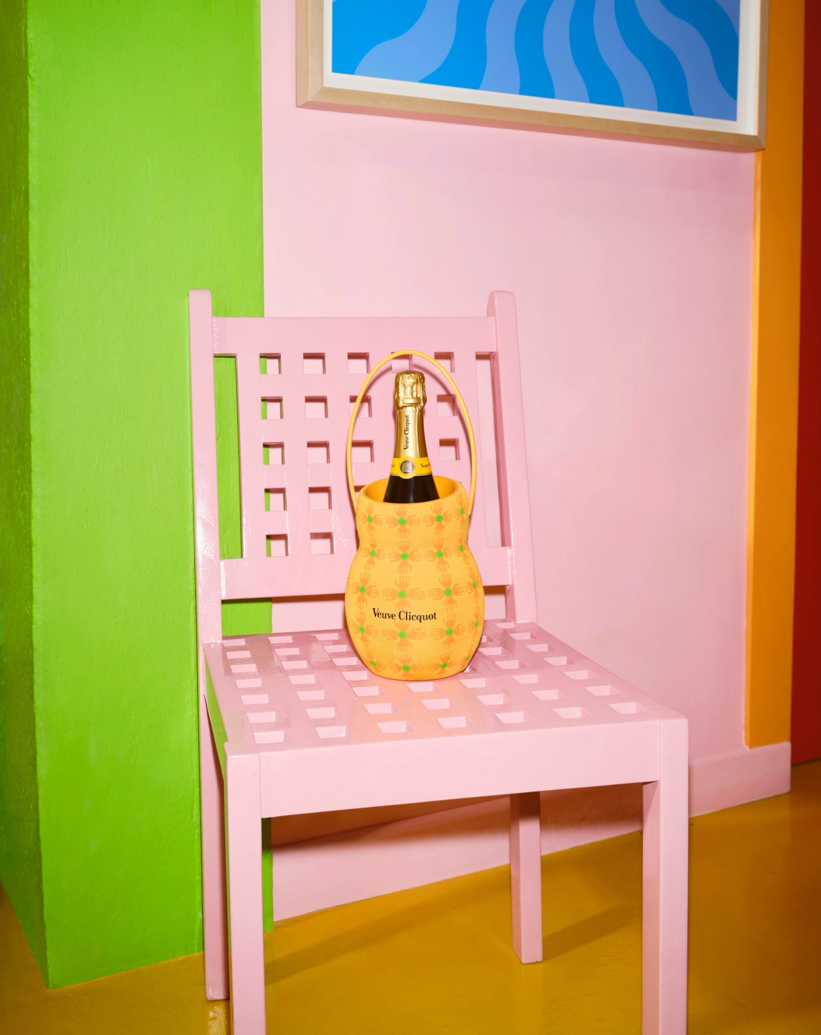 A collection of Veuve Clicquot bottles and gift boxes designed by Yinka Ilori, showing vibrant colors and geometric patterns.