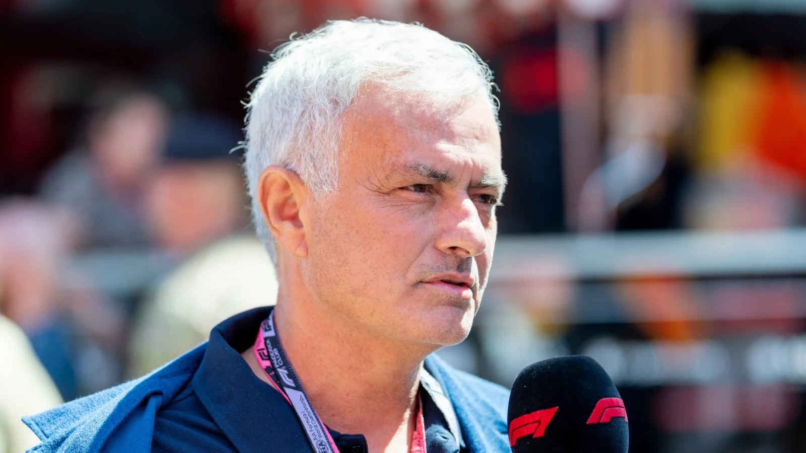 José Mourinho walking through the F1 paddock at the Madring circuit.