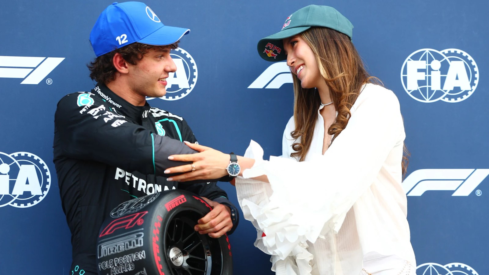 Kimi Antonelli receives the pole position award from Eileen Gu in Monaco