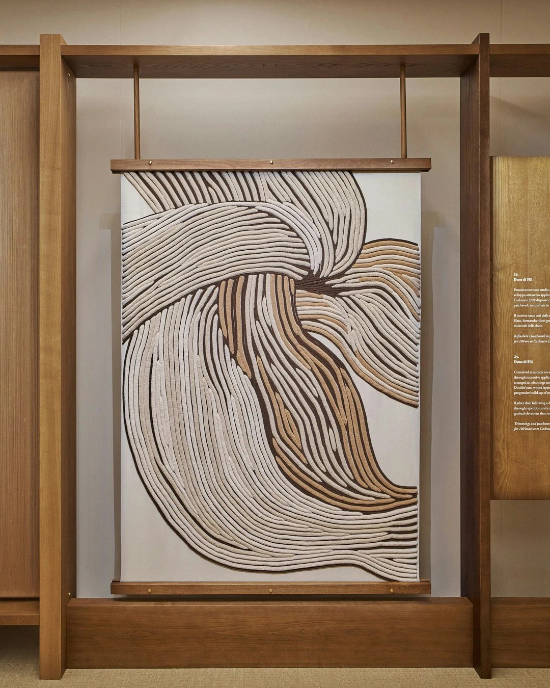 An architectural installation piece featuring Loro Piana plaid in a courtyard.
