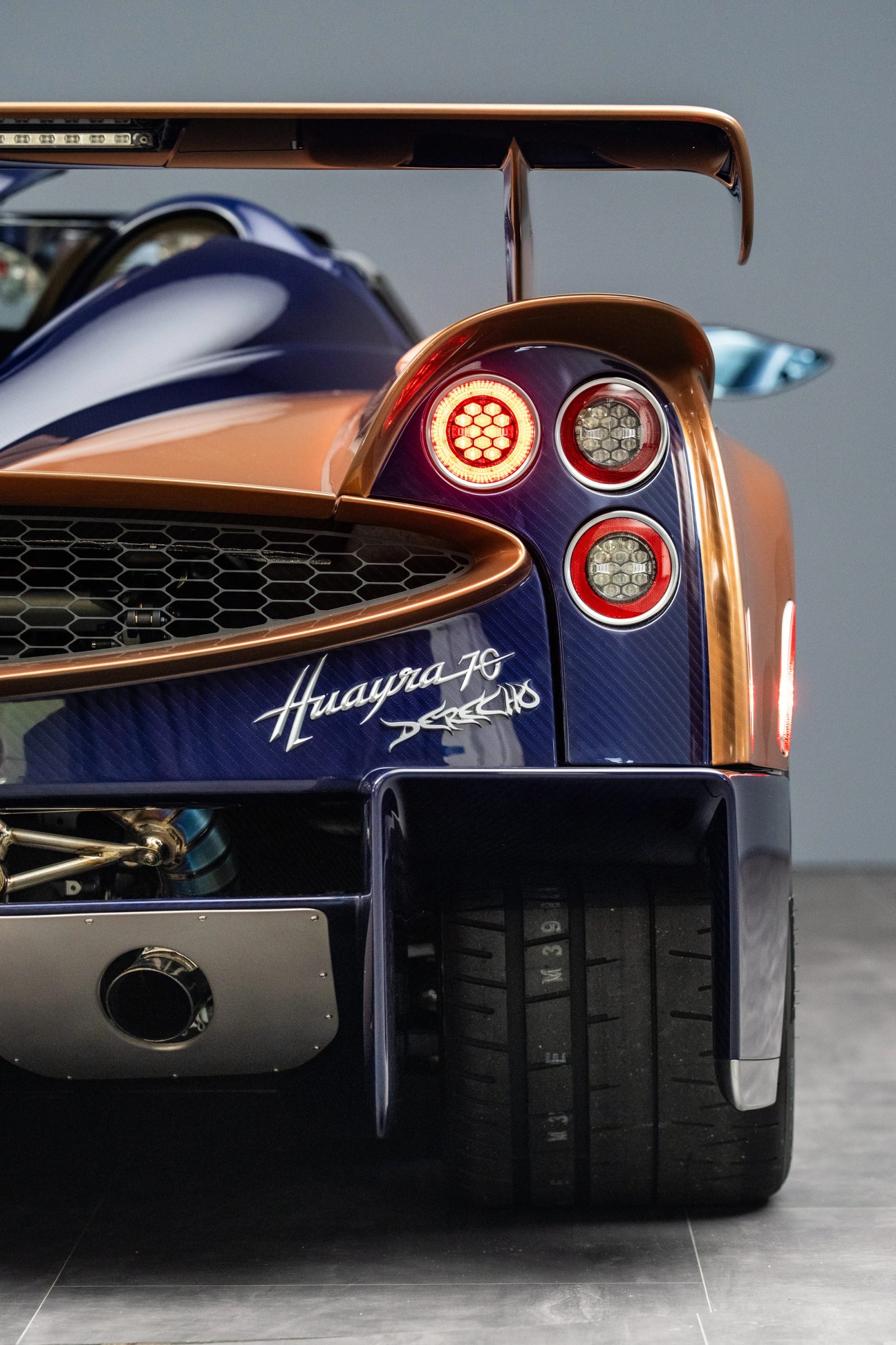The Pagani Huayra 70 Derecho on display, showcasing its aerodynamic form.