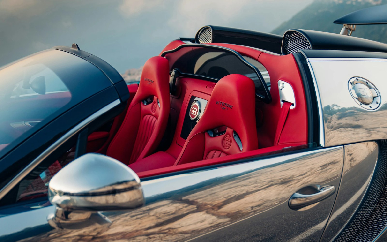 Bugatti Veyron Grand Sport Vitesse with polished aluminum exterior and Carmine Red leather interior.