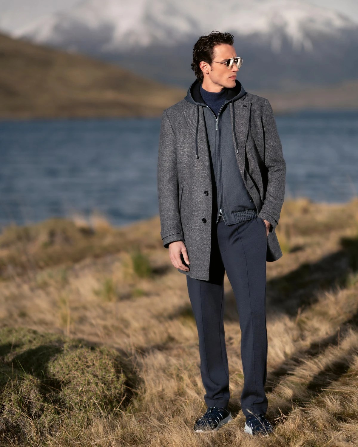 Model posing in Stefano Ricci outerwear in Torres del Paine.