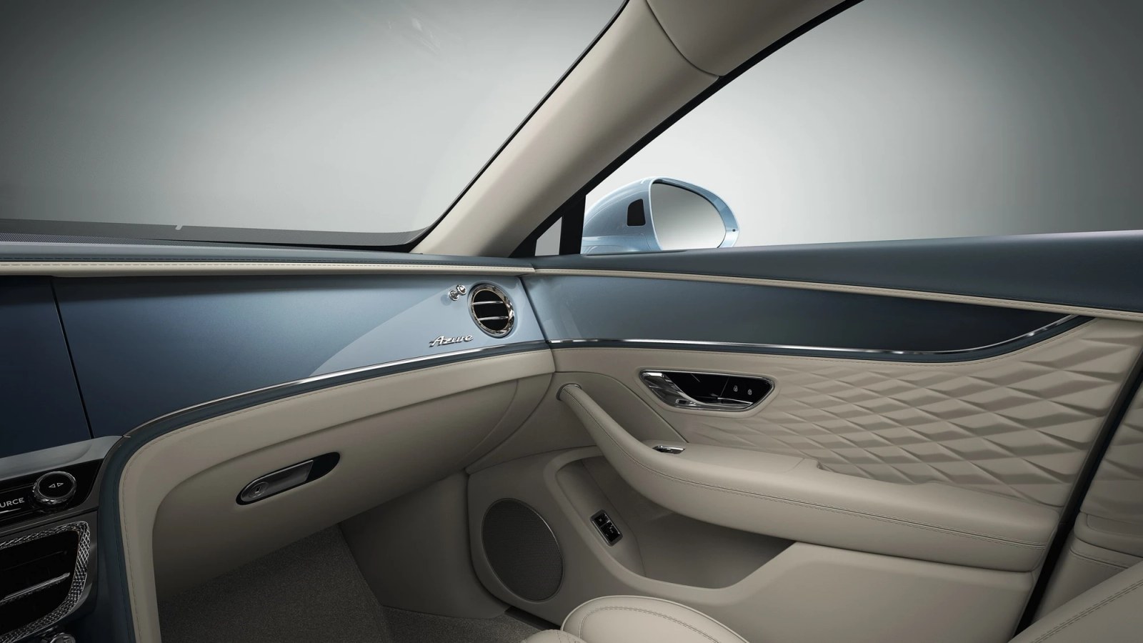 Close-up of a laser-etched veneer in a Bentley, showing a custom design.
