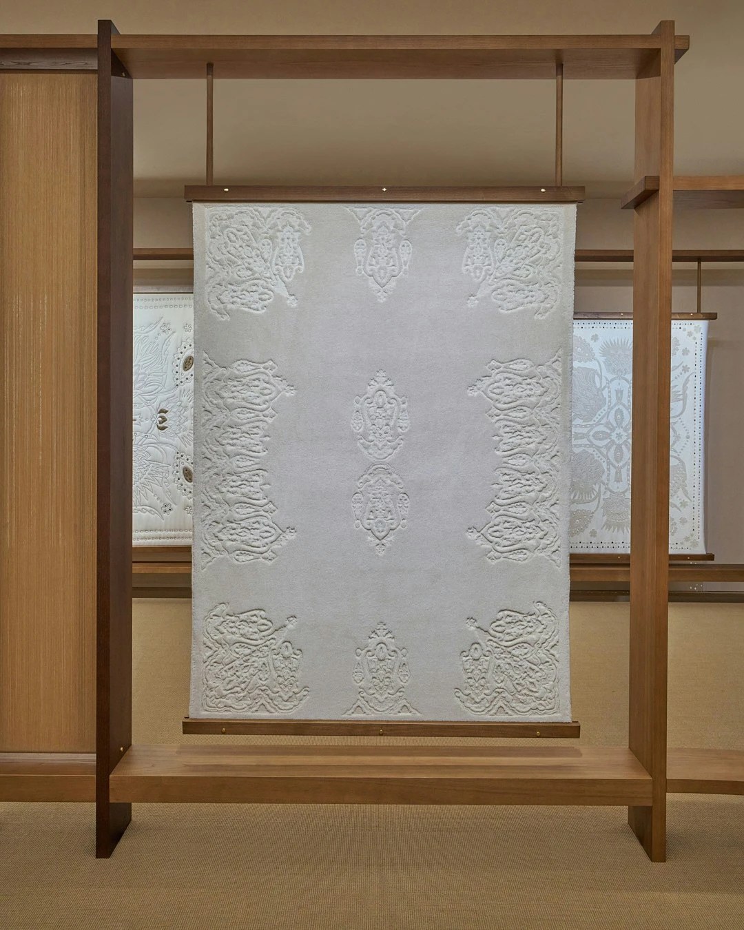 Detail of the texture and weave of a Loro Piana plaid fabric on an installation.