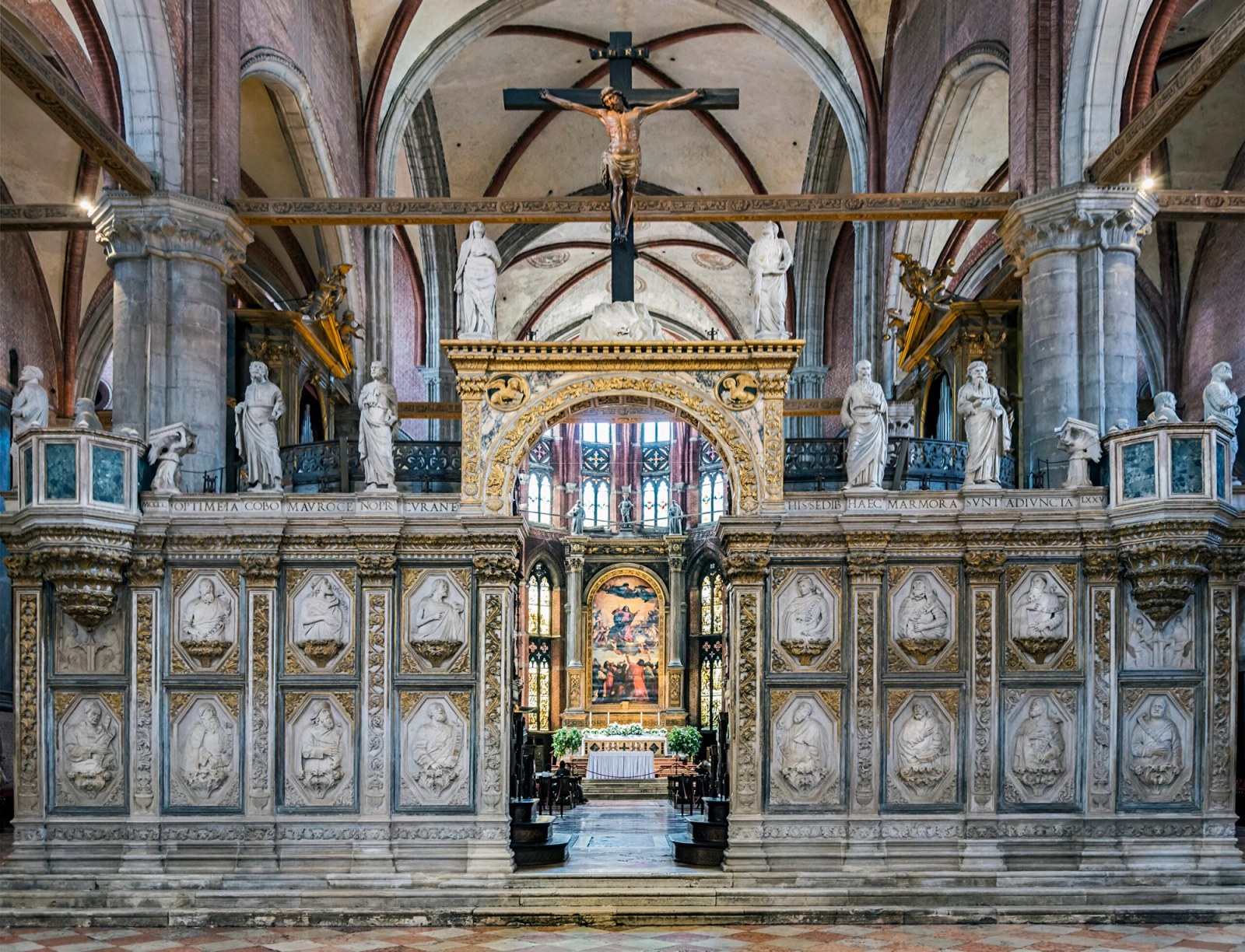 ## **Basilica di Santa Maria Gloriosa dei Frari** | Titian’s “Assumption of the Virgin” seen through the choir-screen at the Basilica di Santa Maria Gloriosa dei Frari. Photo by [Didier Descouens](https://commons.wikimedia.org/wiki/User:Archaeodontosaurus), CC BY-SA 4.0