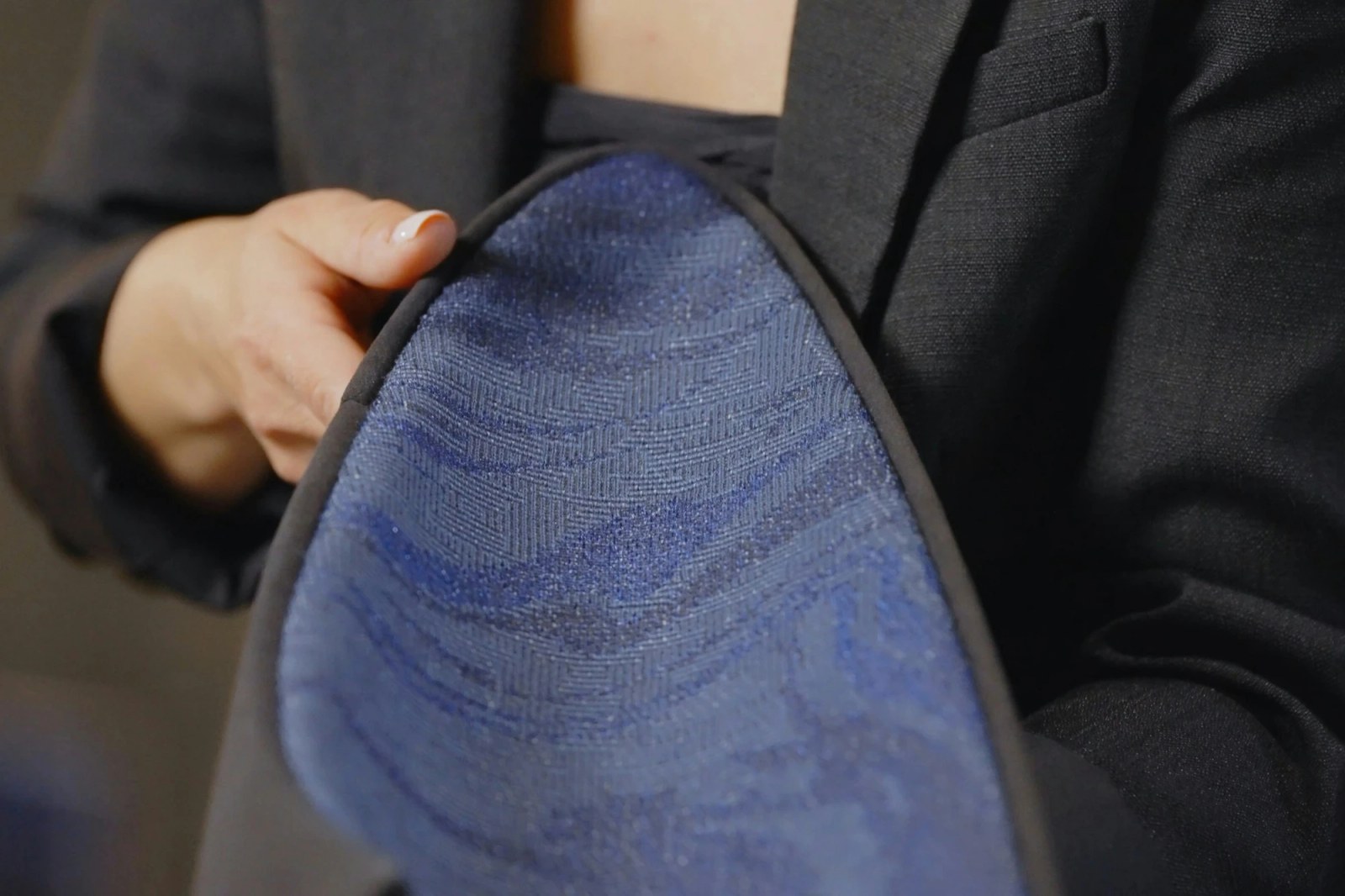 A designer at Bugatti working with fashion-inspired materials.