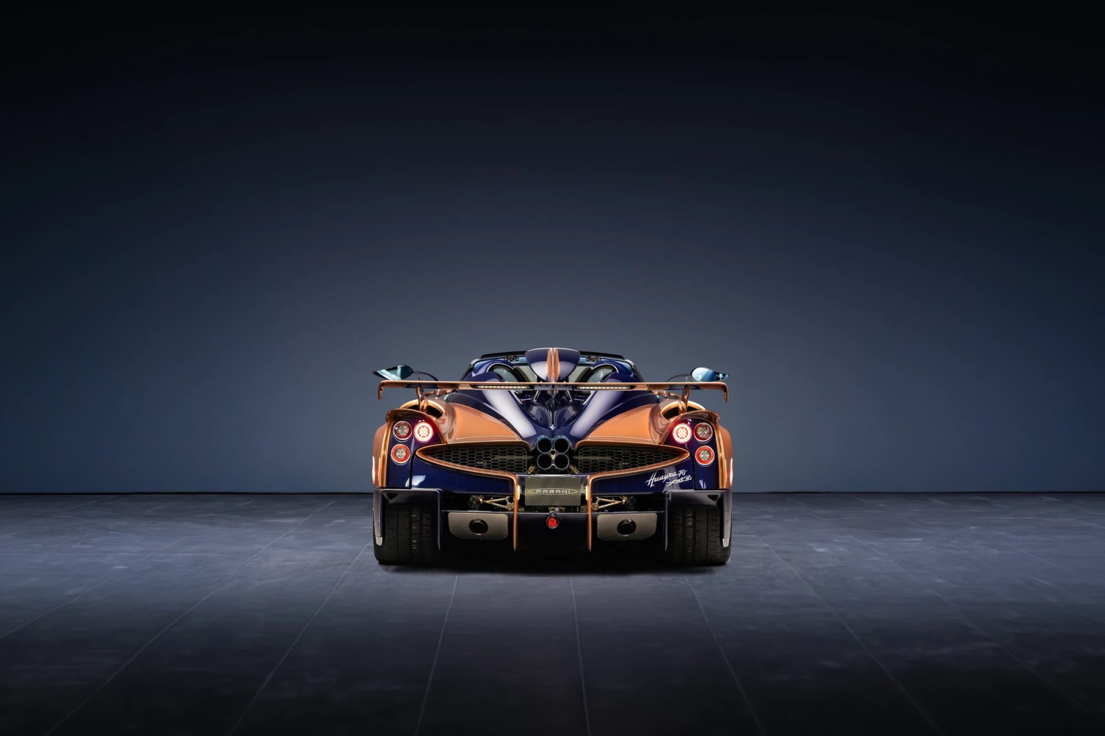 Detailed shot of the Pagani's carbon fiber weave under the Pearl Orange paint.